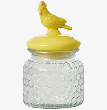 Bild av glasburk med kakadua och bikakemönster