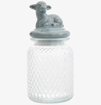 Foto av glasburk med dekorativt lamm på locket