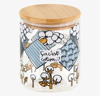 Bild av glasburk med trälock och geometriskt mönster