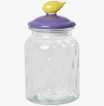 Bild av glasburk med dekorativt lila och gult lock
