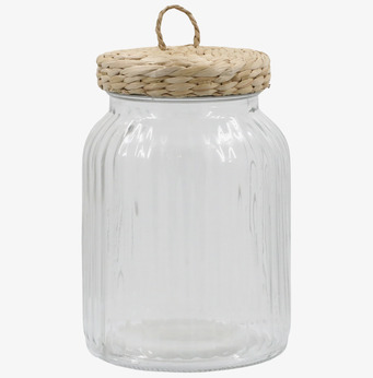 Bild av elegant glasburk med flätat lock och mönster