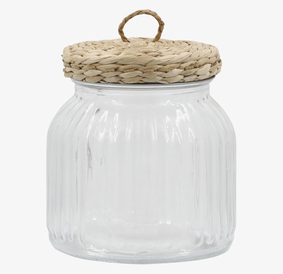 Bild av glasburk med flätat lock och räfflad textur