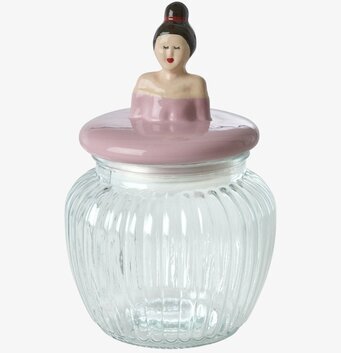 Bild på glasburk med rosa keramiklock och dekorativ figur