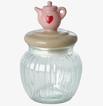Bild på glasburk med dekorativt tekanna-lock och räfflat glas