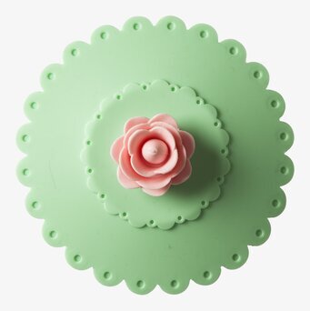 Bild av grönt silikonlock med blommotiv och vågkant