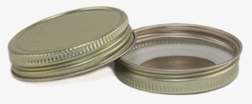 Bild av ett gyllene lock för glasburk med stilren design