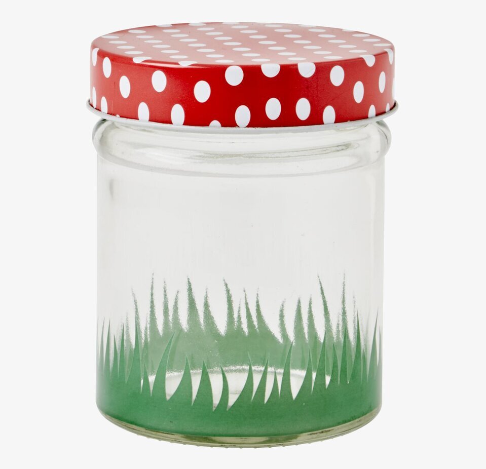 Bild av glasburk med färgglatt lock och naturnära motiv